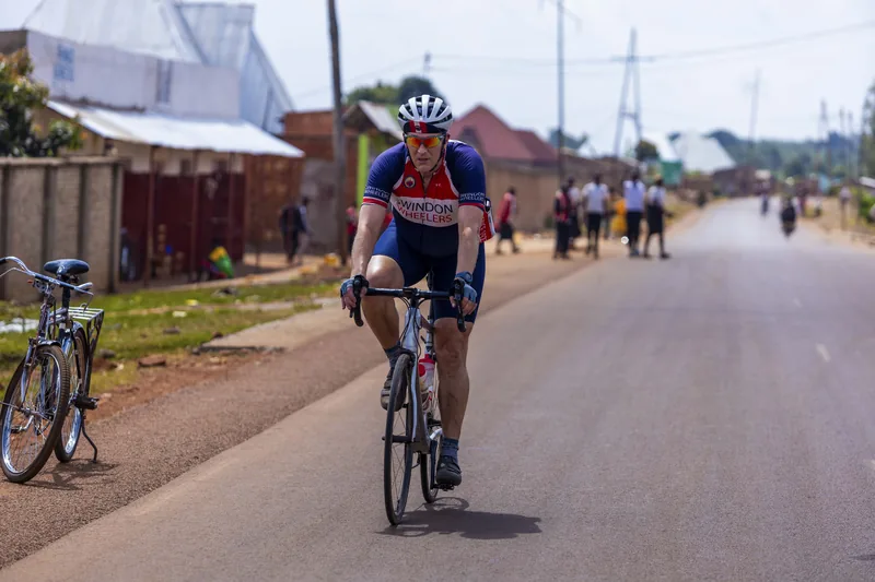A rider coming through a village street